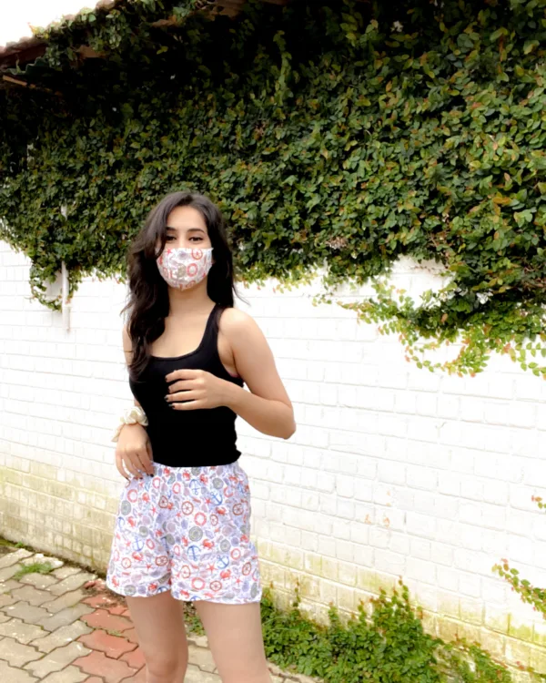 Woman in a Whats Down printed face mask and White Nautical printed boxers. Photo 1