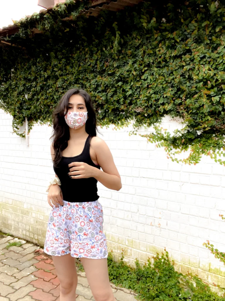 Woman in a Whats Down printed face mask and White Nautical printed boxers. Photo 1