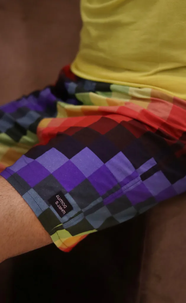 Man in a yellow shirt and Whats Down Multicolour Pixels printed boxers. Photo 2