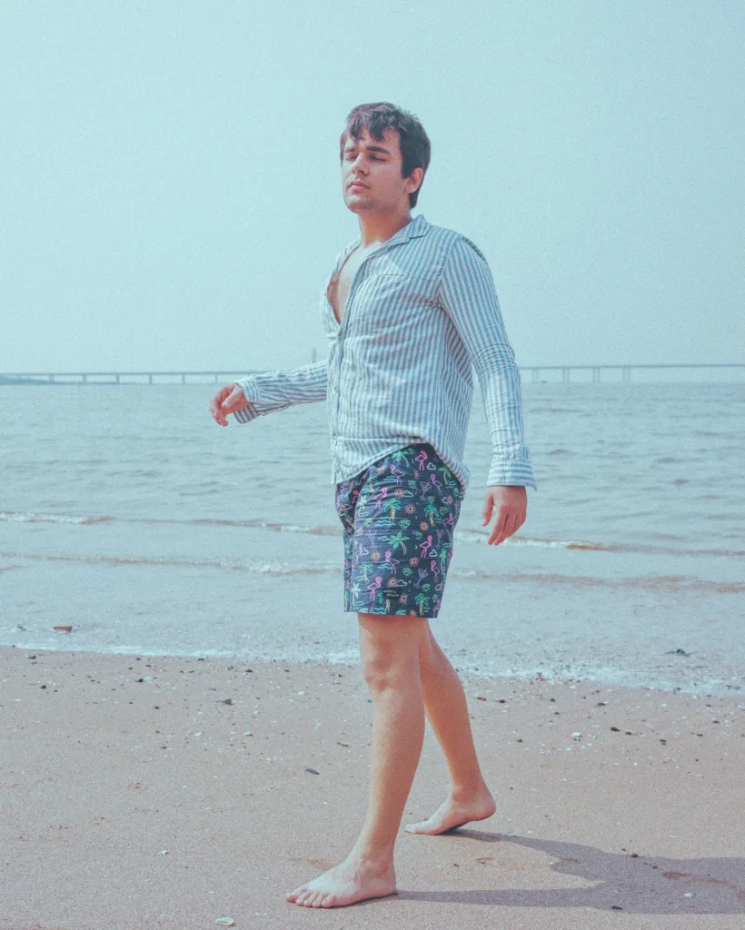 Man in Whats Down Blue Nautical printed boxers at the beach. Photo 4
