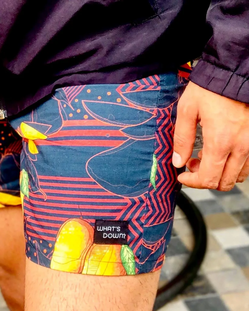 Man in Whats Down Orange Mango printed boxers in the snow. Photo 2
