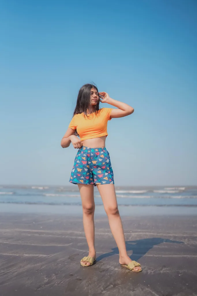 Woman at the beach in Whats Down Grey Paper Planes printed boxers. Photo 6