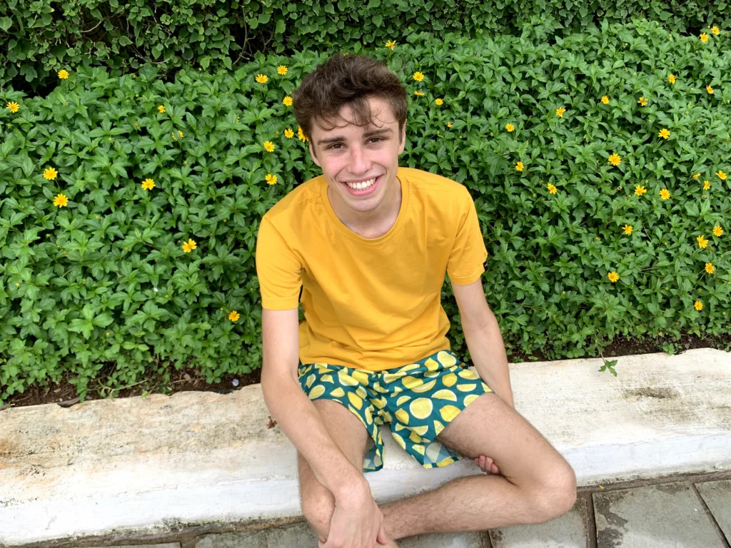 Man in a yellow tee and Whats Down Green Lemon printed boxers. Photo 1