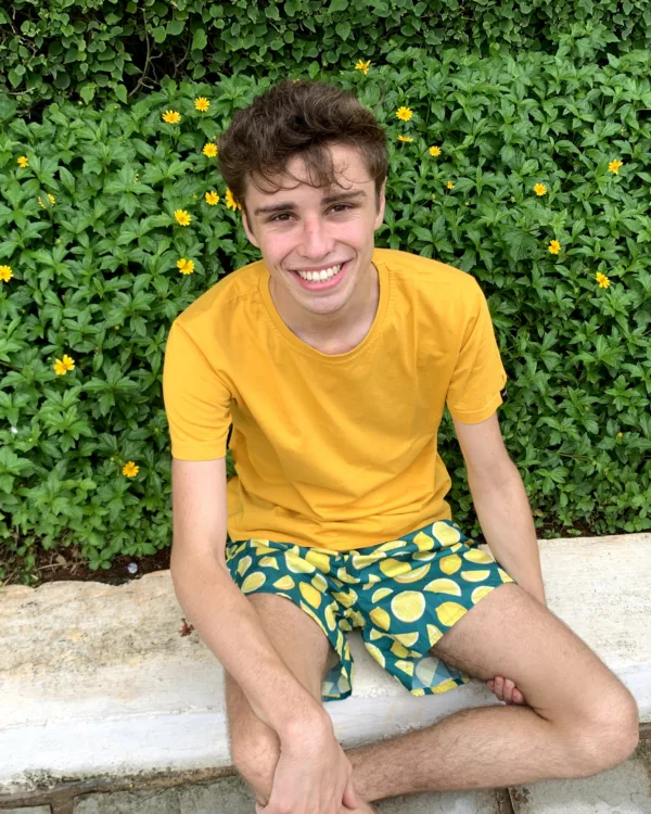 Man in a yellow tee and Whats Down Green Lemon printed boxers. Photo 1