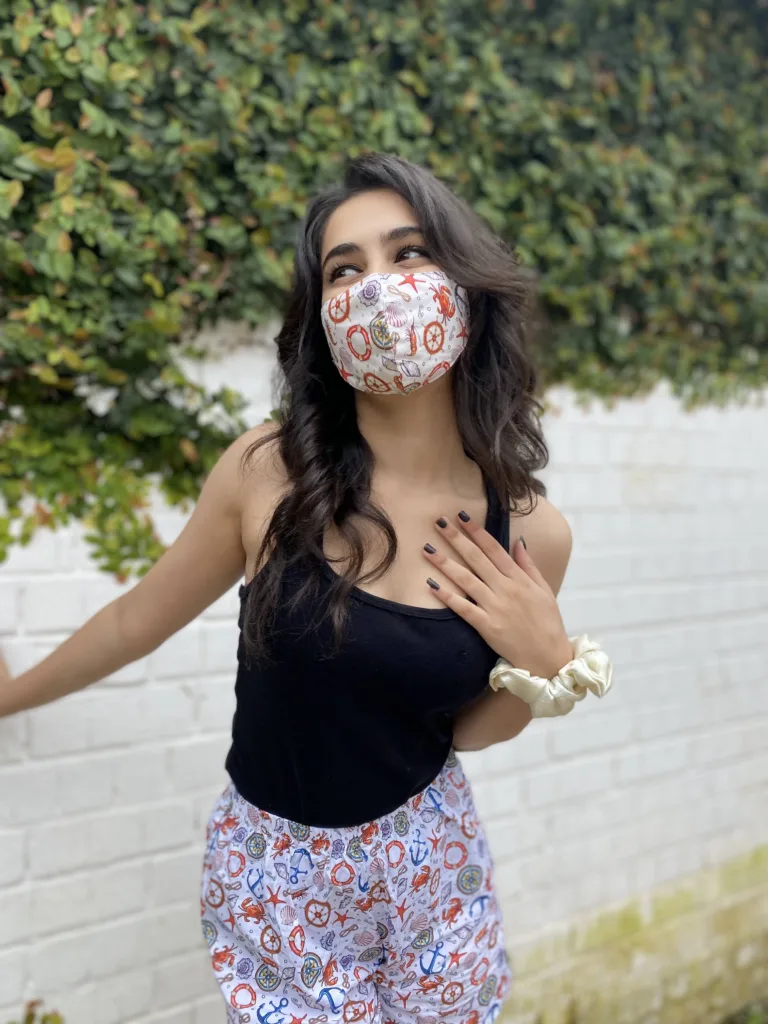 Woman in a Whats Down printed face mask and White Nautical printed boxers. Photo 3