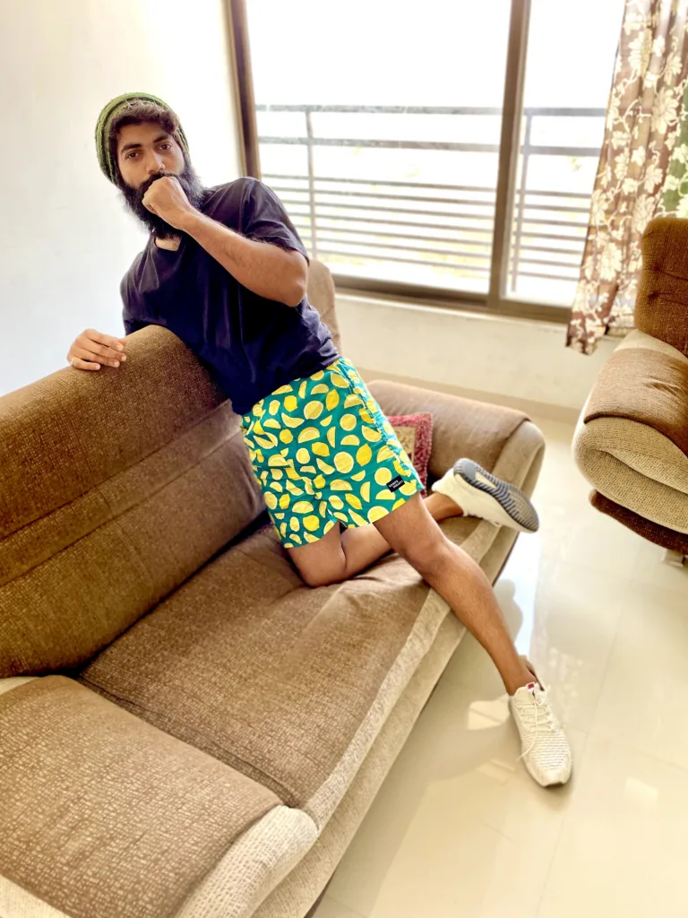 Man in a yellow tee and Whats Down Green Lemon printed boxers. Photo 4