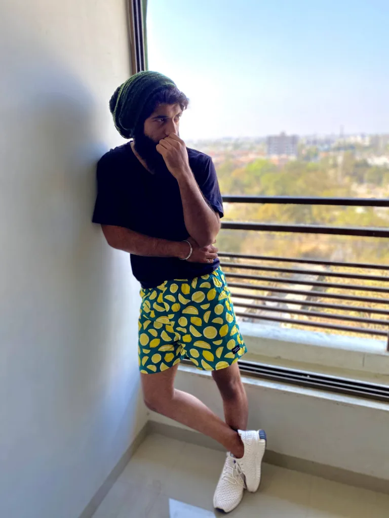 Man in a yellow tee and Whats Down Green Lemon printed boxers. Photo 6