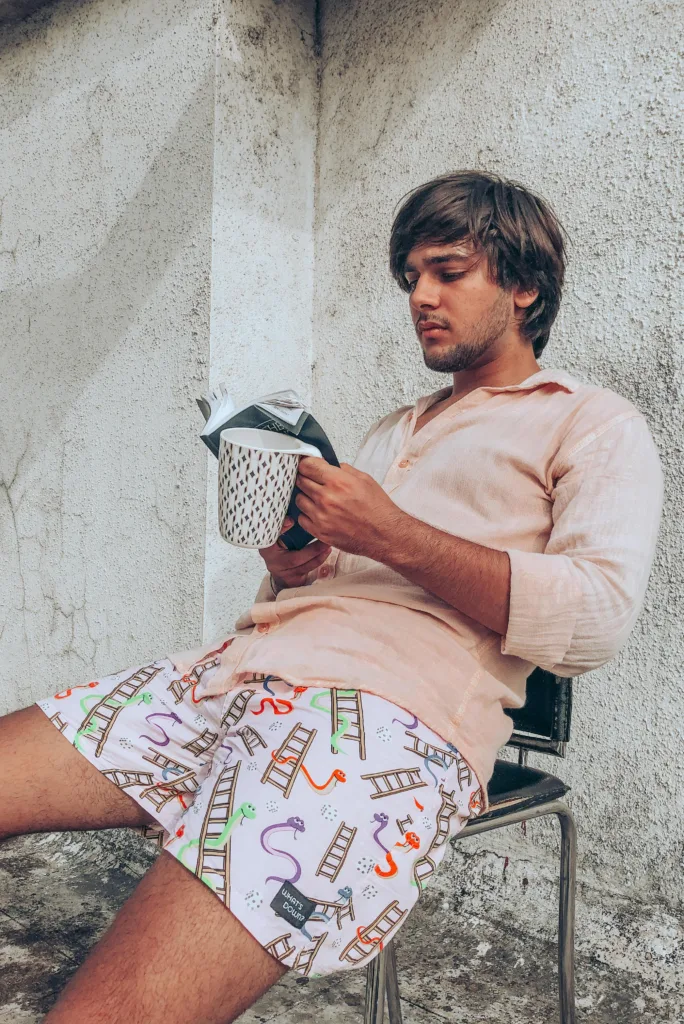Man in Whats Down Pink Snakes & Lads printed boxers. Photo 3