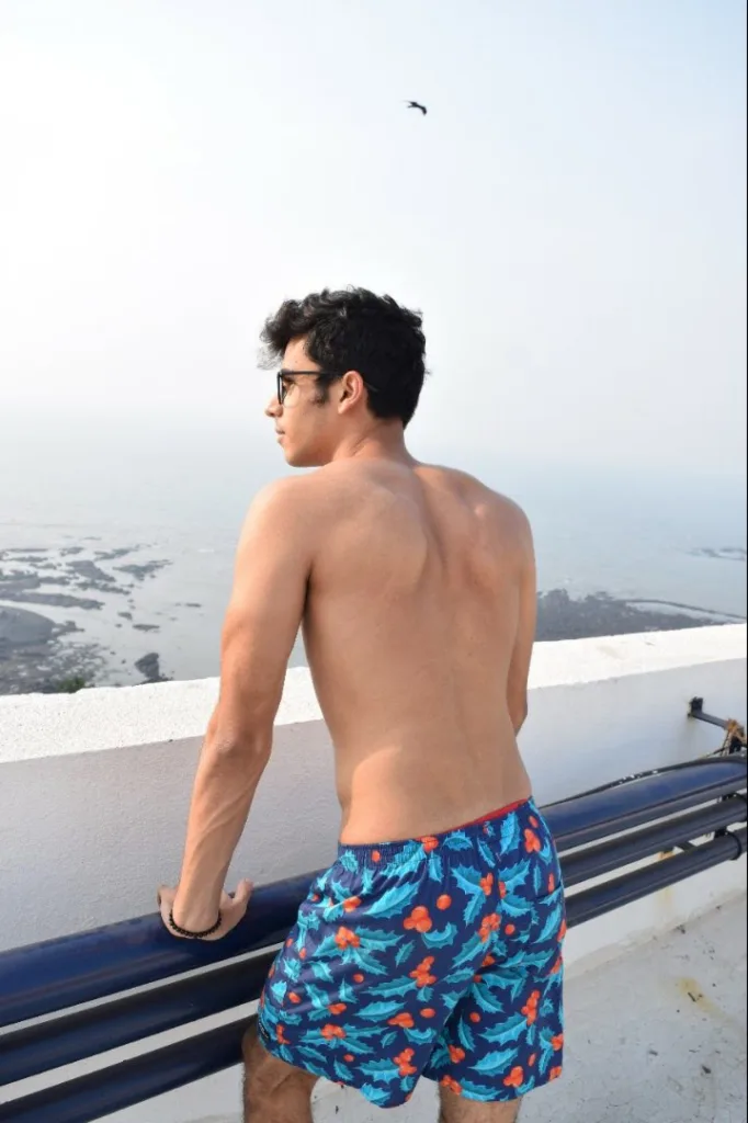 Man in Whats Down Blue Mistletoe printed boxers on a rooftop. Photo 2