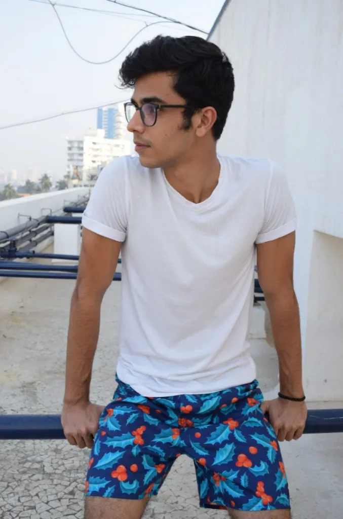 Man in Whats Down Blue Mistletoe printed boxers on a rooftop. Photo 3