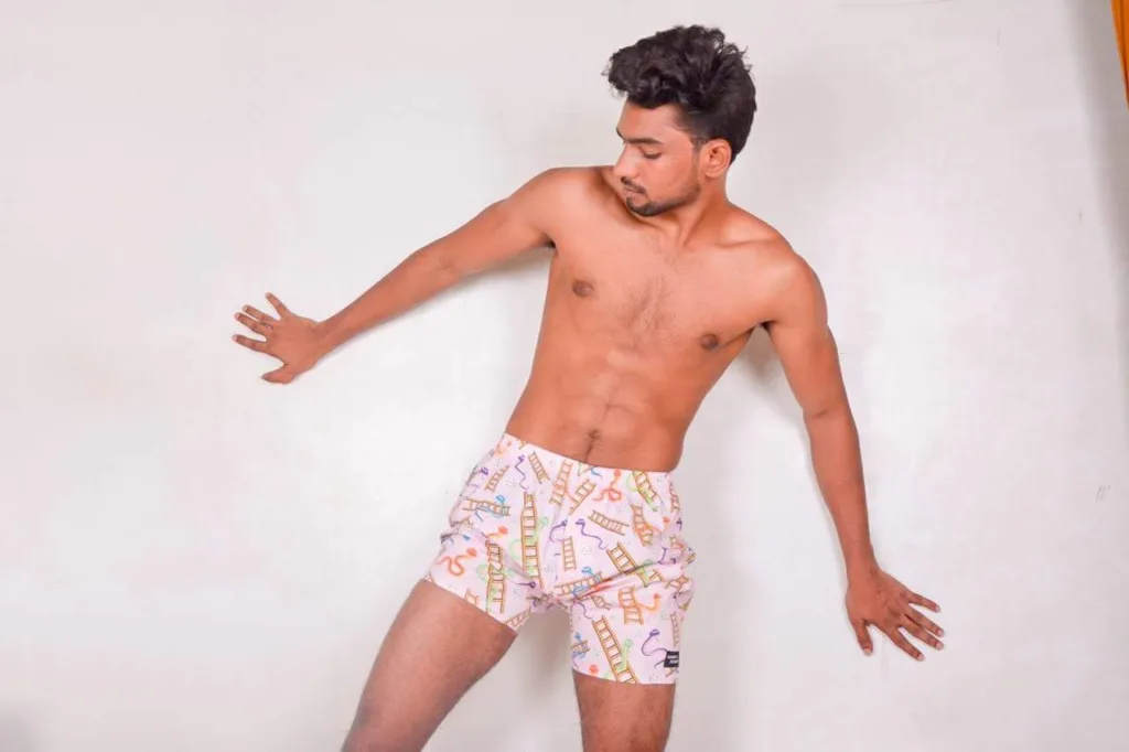 Man in Whats Down Pink Snakes & Lads printed boxers. Photo 2