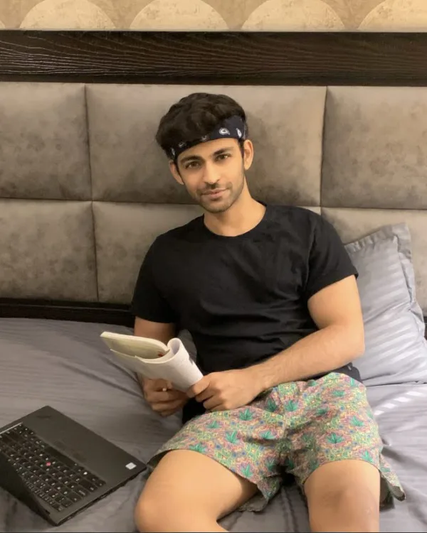 Man on the bed in Whats Down printed boxers with a laptop. Photo 4