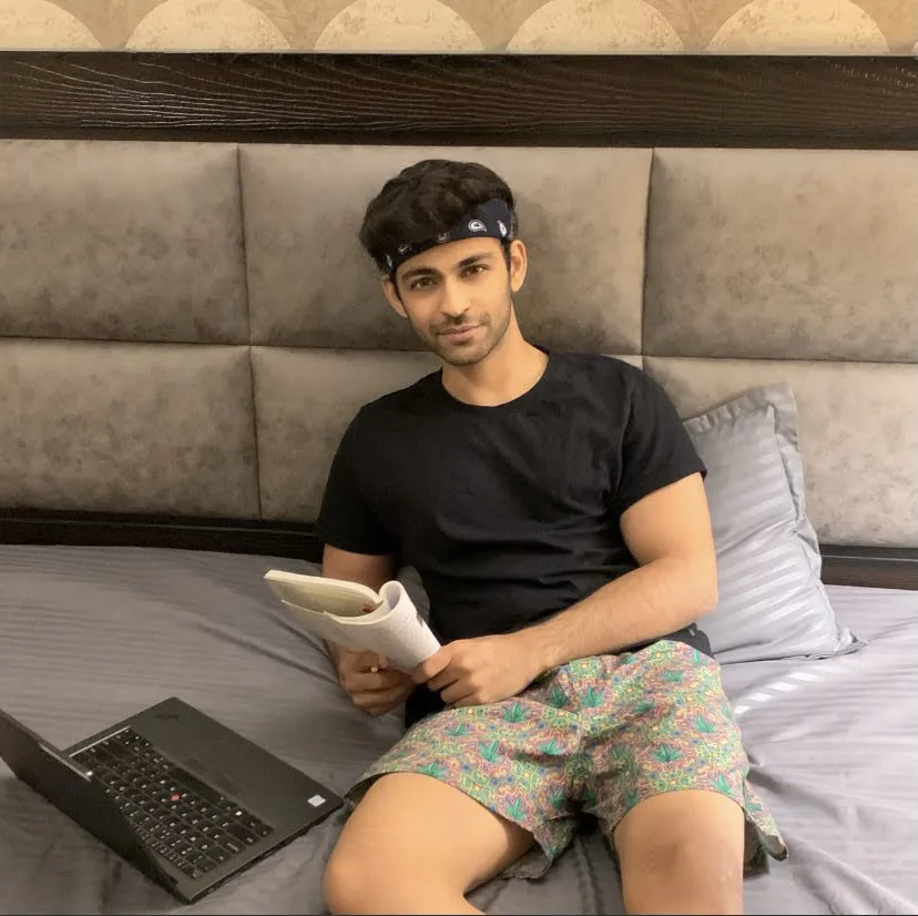 Man on the bed in Whats Down printed boxers with a laptop. Photo 4